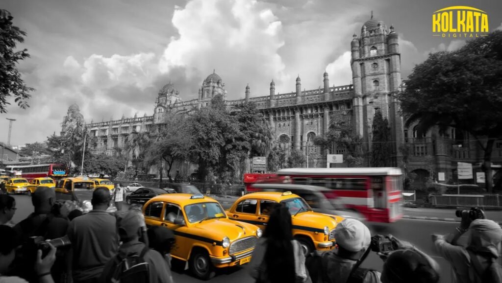 Iconic yellow taxis passing in front of Writers' Building in Kolkata symbolizing tourism-driven urban business activity